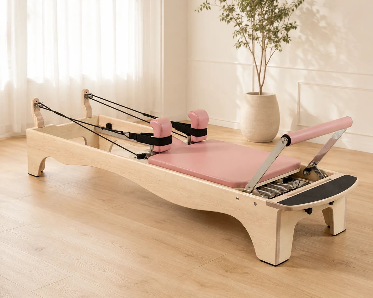 CP167 maple wood Pilates reformer in a bright studio