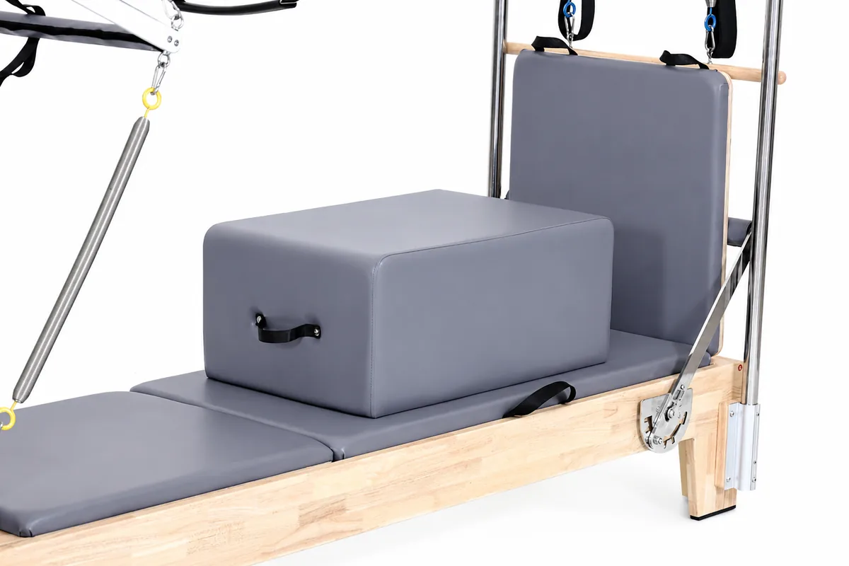 Oak Pilates reformer with full tower studio view